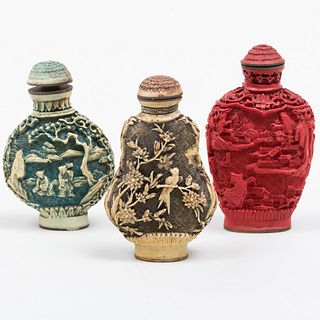 Three Chinese Carved and Stained Composite Snuff Bottles