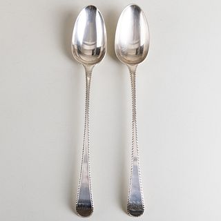 Pair of George III Silver Stuffing Spoons with Feather Edge and Crest