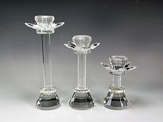 3 CRYSTAL LOTUS CANDLESTICKS IN VARYING HEIGHTS