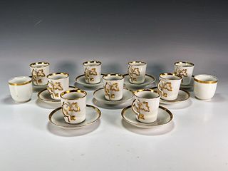 ASSEMBLED GOLD TRIMMED DEMITASSE CUPS AND SAUCERS