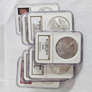 Group of Seven NGC MS 69 Graded American Eagle Silver Dollars