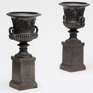 Pair of Regency Style Polished Steel Garden Urns on Pedestals