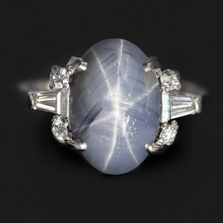 PLATINUM STAR SAPPHIRE & DIAMOND RING, 4.58 dwt., .15ct.TW ROUND H-J VS .15ct.TW BAGUETTE H-J VS Diamonds 7.00ct.TW OVAL SAPPHIRE BLUE Â  Center Stone