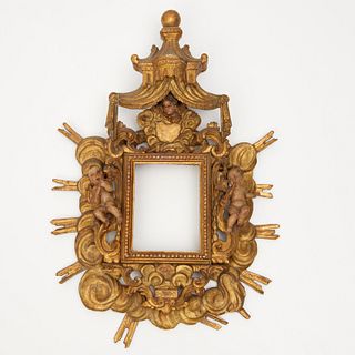 Italian Rococo carved giltwood devotional frame