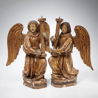 Pair Continental giltwood angel candle prickets