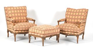 Pair of Regence Style Carved Walnut Fauteuils and Ottoman