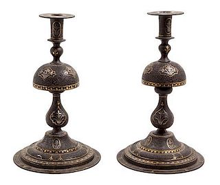 * A Pair of Syrian Metal Inlaid Candlesticks Height 11 inches.