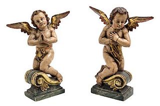 * A Pair of Continental Polychromed Figural Ornaments Height 12 1/4 inches.
