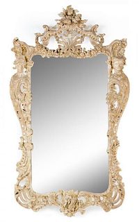 A Rococo Style Limed Wood Mirror Height 75 x width 43 inches.