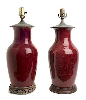 * Two Sang de Boeuf Glazed Vases Height overall 21 inches.