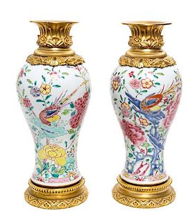 A Pair of French Gilt Metal Mounted Porcelain Vases Height 11 1/2 inches.