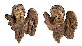 * A Pair of French Painted Putto Masks Height 25 inches.
