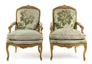 * A Pair of Louis XV Giltwood Fauteuils a la Reine Height 40 inches.