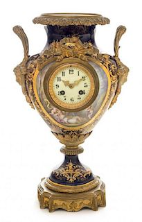 * A Sevres Gilt Bronze Mounted Porcelain Clock Height 16 7/8 inches.