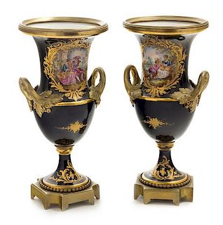 * A Pair of Sevres Style Gilt Bronze Mounted Porcelain Urns Height 10 1/4 inches.