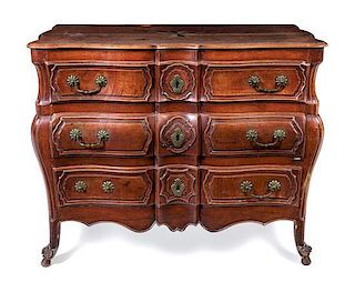 * A Louis XV Fruitwood Commode en Tombeau Height 36 x width 50 1/2 x depth 26 1/2 inches.