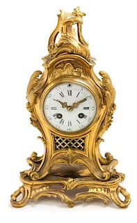 * A Louis XV Style Gilt Bronze Mantel Clock Height 13 3/4 inches.