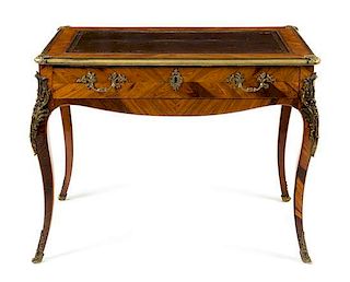 A Louis XV Style Gilt Bronze Mounted Tulipwood Table a Ecrire Height 29 3/4 x width 37 3/4 x depth 23 1/8 inches.