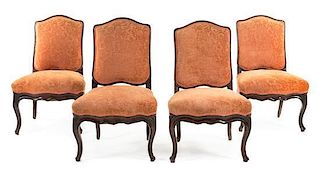 A Set of Four Louis XV Walnut Side Chairs Height 36 1/2 inches.