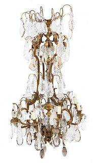 * A French Gilt Bronze and Rock Crystal Eight-Light Chandelier Height 50 inches.