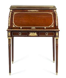 A Louis XVI Style Gilt Bronze Mounted Mahogany and Parquetry Bureau a Cylindre Height 42 3/8 x width 32 1/8 x depth 20 3/4 in