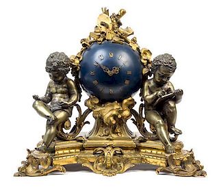 A French Gilt Bronze Figural Mantel Clock Height 18 inches.