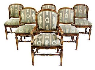 * A Suite of Six Louis XVI Style Parcel Gilt Walnut Dining Chairs Height 38 3/4 inches.