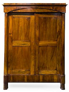 An Empire Style Mahogany Armoire Height 81 1/2 x width 62 1/2 x depth 25 1/2 inches.
