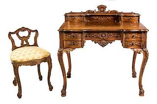 * A Baroque Style Carved Writing Desk and Chair Height of desk 38 1/2 x width 36 x depth 22 1/2 inches.