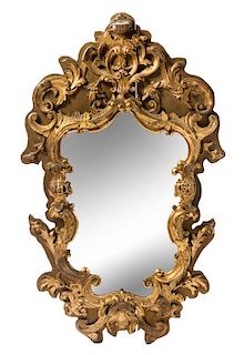 * An Italian Baroque Style Giltwood Mirror Height 43 x width 26 1/2 inches.