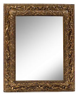 * A Northern Italian Giltwood Mirror Height 42 1/2 x width 35 inches.