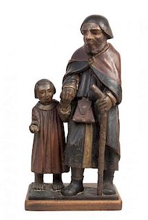 * A Spanish Polychromed Wood Figural Group Height 26 inches.