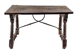 * A Spanish Baroque Style Iron Mounted Walnut Table Height 30 x width 51 x depth 33 inches.