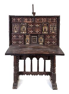 * A Spanish Baroque Style Walnut Vargueno and Stand Height 58 x width 40 x depth 17 inches.