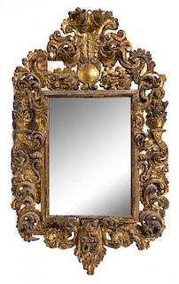 * A Baroque Giltwood Mirror Height 52 x width 32 inches.