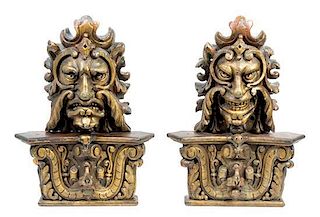 A Pair of Continental Giltwood Grotesque Masks Height 24 inches.