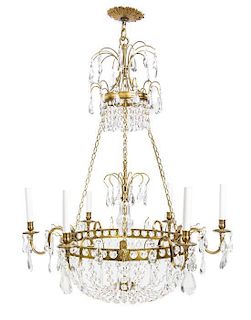 A Continental Gilt Metal and Cut Glass Six-Light Chandelier Height 36 inches.