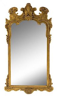 A George II Style Giltwood Mirror Height 44 1/4 x width 24 1/4 inches.