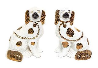 A Pair of Staffordshire Spaniels Height 9 1/2 inches.
