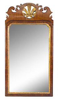 * A Chippendale Style Parcel Gilt Mirror Height 32 1/2 x width 16 1/2 inches.