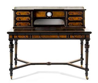 An Aesthetic Movement Parcel Ebonized Writing Desk Height 41 1/2 x width 48 x depth 24 1/2 inches.