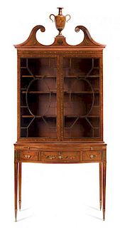 * An Edwardian Painted Satinwood Bookcase Height 90 inches.