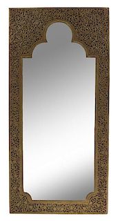 An Indian Brass Mirror Height 46 x width 22 inches.