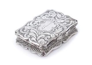 A Victorian Silver Vinaigrette, Francis Clark, Birmingham, 1841, the case worked to show foliate volutes, the lid centered by