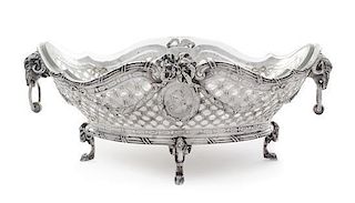 A German Silver Center Bowl, Circa 1900, of oval form, the latticework sides with opposing profile medallions suspended from 