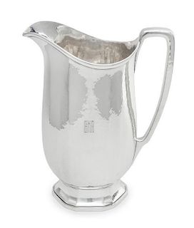 * An American Silver Water Pitcher, Tiffany & Co., New York, NY, the body with a spot-hammered finish, monogrammed EMR.