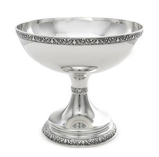 * An American Silver Fruit Bowl, Tiffany & Co., New York, NY, the rim with a volute, rocaille and floral decorated band, rais