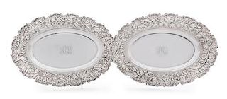 * A Pair of American Silver Serving Platters, S. Kirk & Son, Baltimore, MD, each having a repousse floral decorated border an