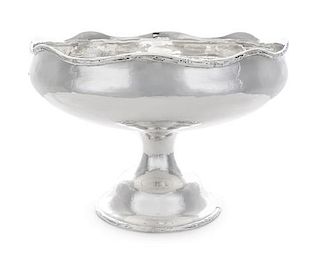 An American Silver Center Bowl, Gorham Mfg. Co., Providence, RI, the undulating rim decorated with branch motifs, the body wi