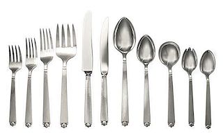 An American Silver Flatware Service, Spaulding & Co., Chicago, IL, the service with a spot-hammered finish and a foliate and 